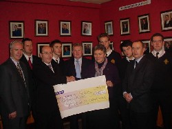 Pictured in the photograph are Mr John Farrell Provincial Grand Knight and Mr Matt McEvoy Provincial Registrar of the Knights Of Columbanus, Mr Dermot McGovern (Headmaster), and the Zambian Immersion Team - Sr Anne Lyng, Mr Mark Grogan, Mr Hugh Markey, Kevin Dyas, Richard Gilmore, Mark McGuigan and Kevin McKernan. Missing are Kevin McManus, Michael OHare, Aodhan Rafferty and Darren Rowland.